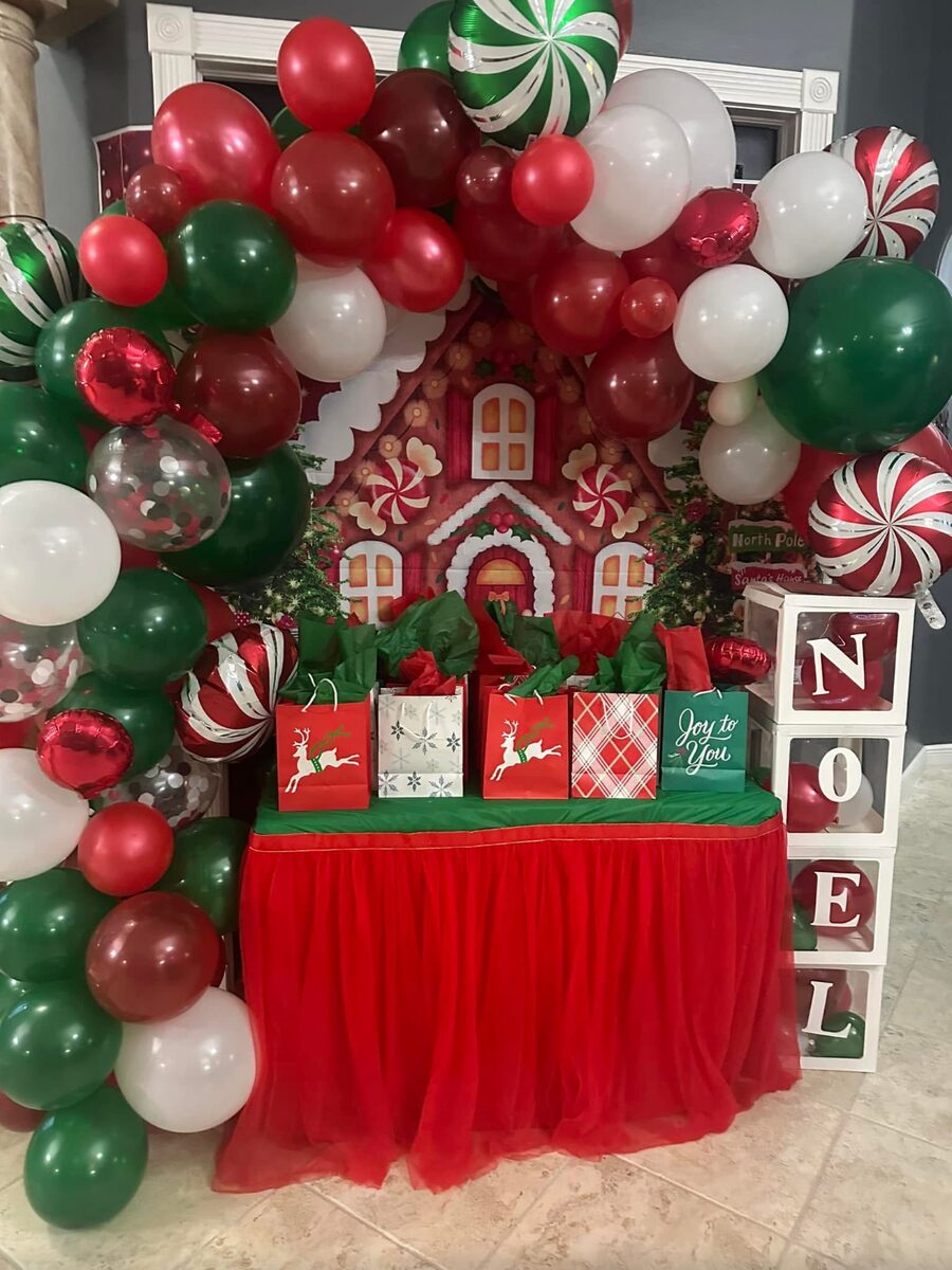 Christmas gingerbread themed balloon arch